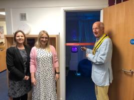 Past president Bruce Banister-Harding cuts the ribbon to open the new Sensory Room
